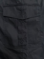 Black Louis Vuitton pants with embossed logo patch and stitched details