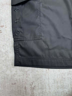 Black cargo pants pocket flap with star and circular emblem logos