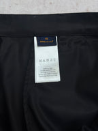 Black Louis Vuitton pants with size and care label tag