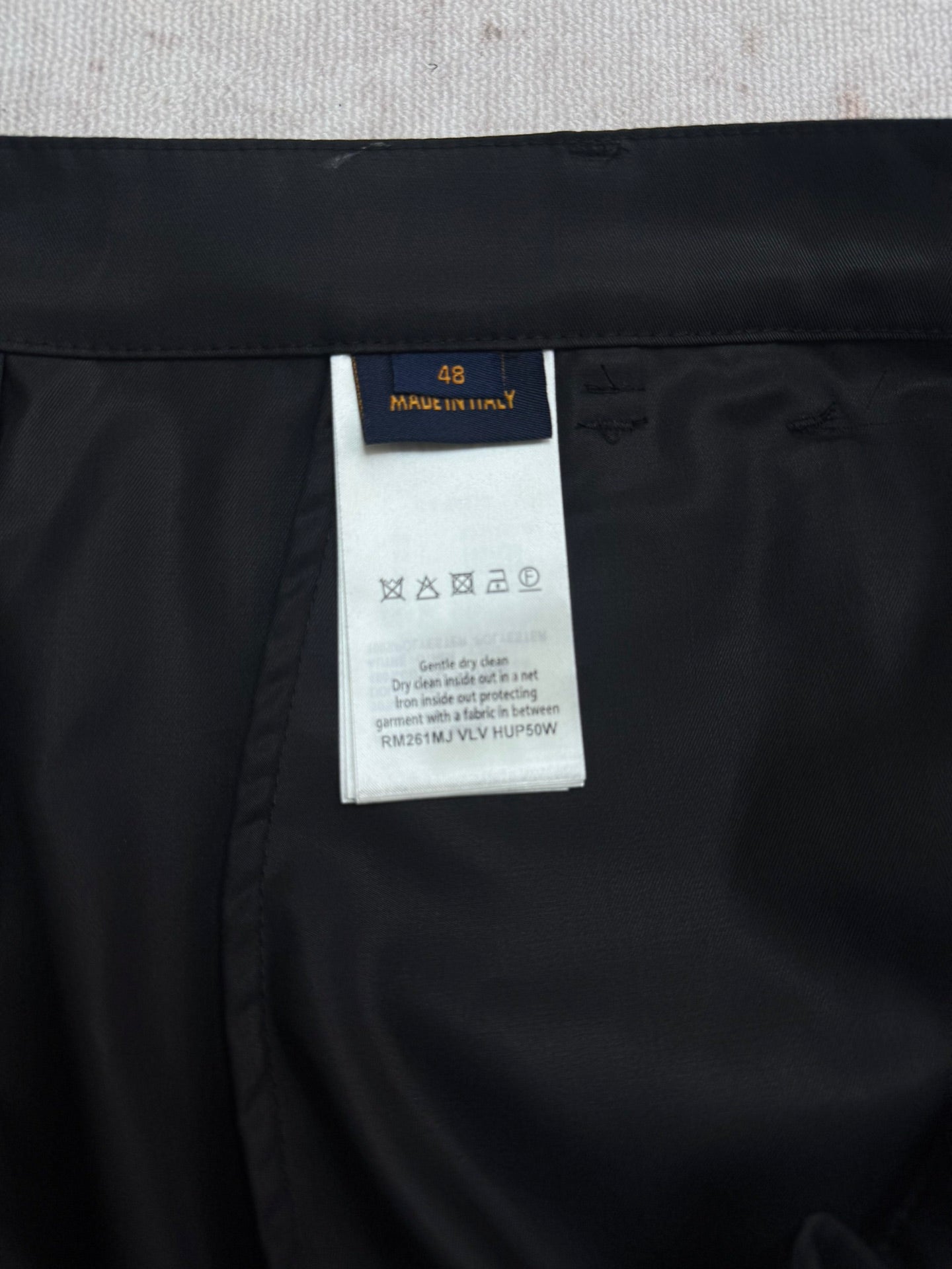 Black Louis Vuitton pants with size and care label tag