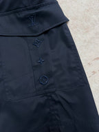 Navy Louis Vuitton shorts with embroidered star and logo-style pocket detailing.