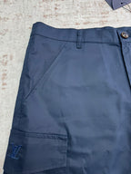 Navy Louis Vuitton shorts front with belt loops and deep cargo pocket.