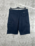 Navy Louis Vuitton cargo shorts with front pleats and side flap pockets.