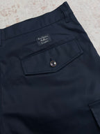 Navy Louis Vuitton shorts with front pocket and round button at waistband.