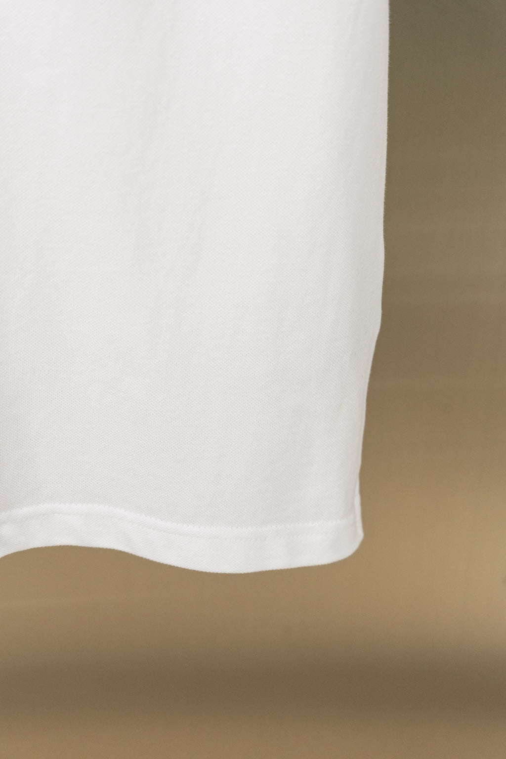 White polo shirt curved bottom hem