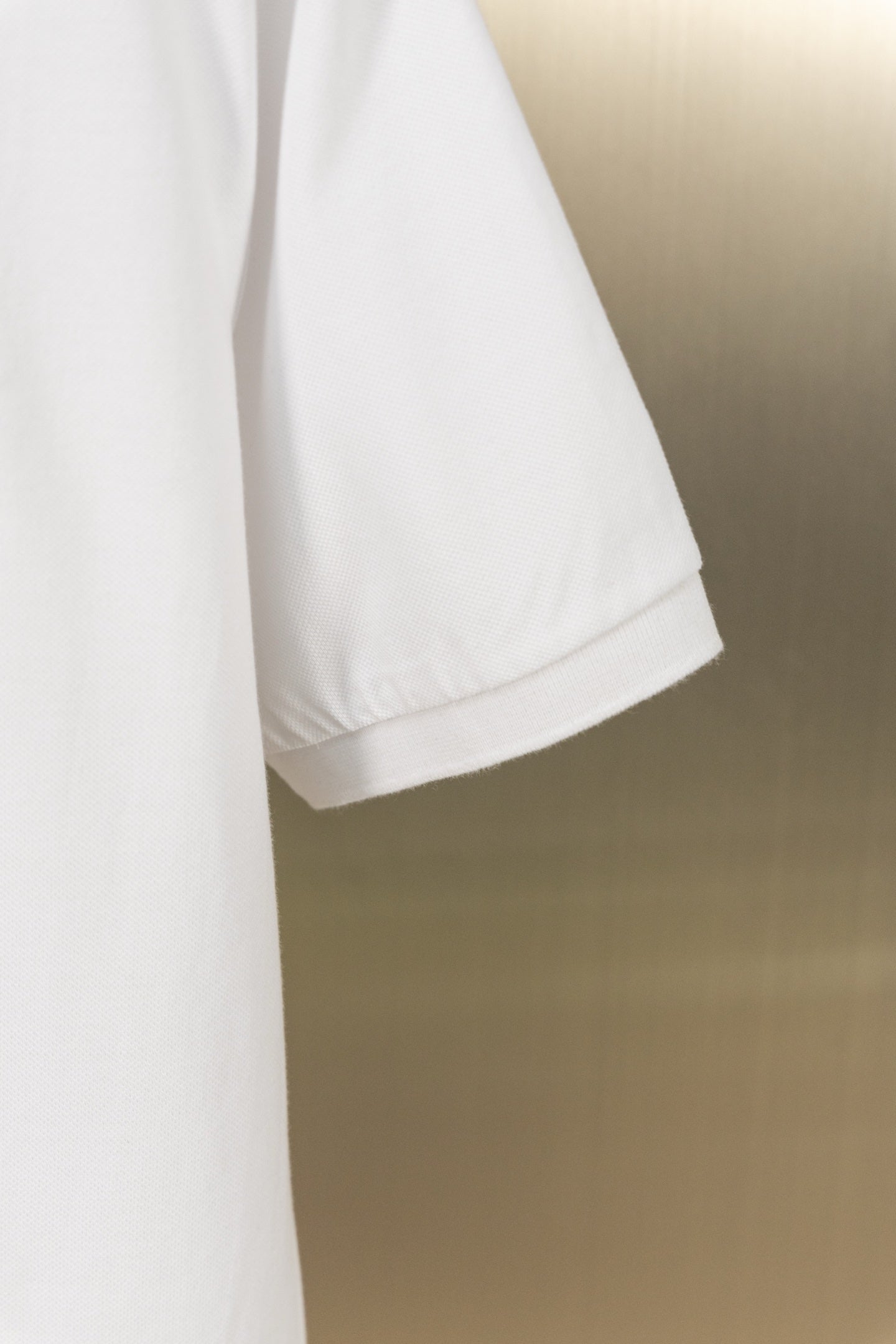 White polo shirt sleeve hem