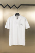 White polo shirt with short sleeves, button placket, embroidered logo at chest
