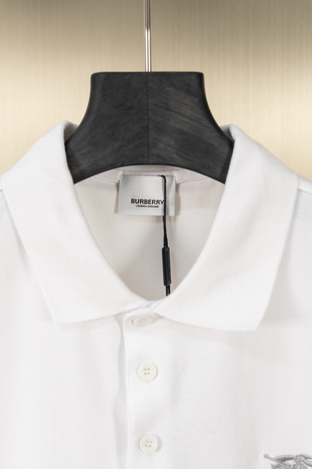 White polo shirt collar with two-button placket and neck label