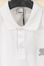 White polo shirt close-up with button placket and embroidered horse emblem