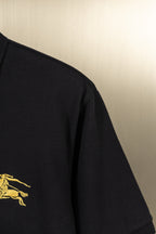 Burberry black polo shirt side with gold horse logo