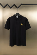 Burberry black polo shirt with gold horse logo on chest