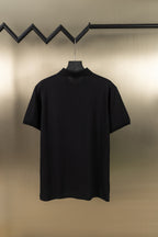 Burberry black polo shirt front view with collar and button placket