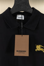 Burberry black polo shirt with hang tag and gold horse logo