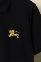 Burberry black polo shirt sleeve with gold horse logo