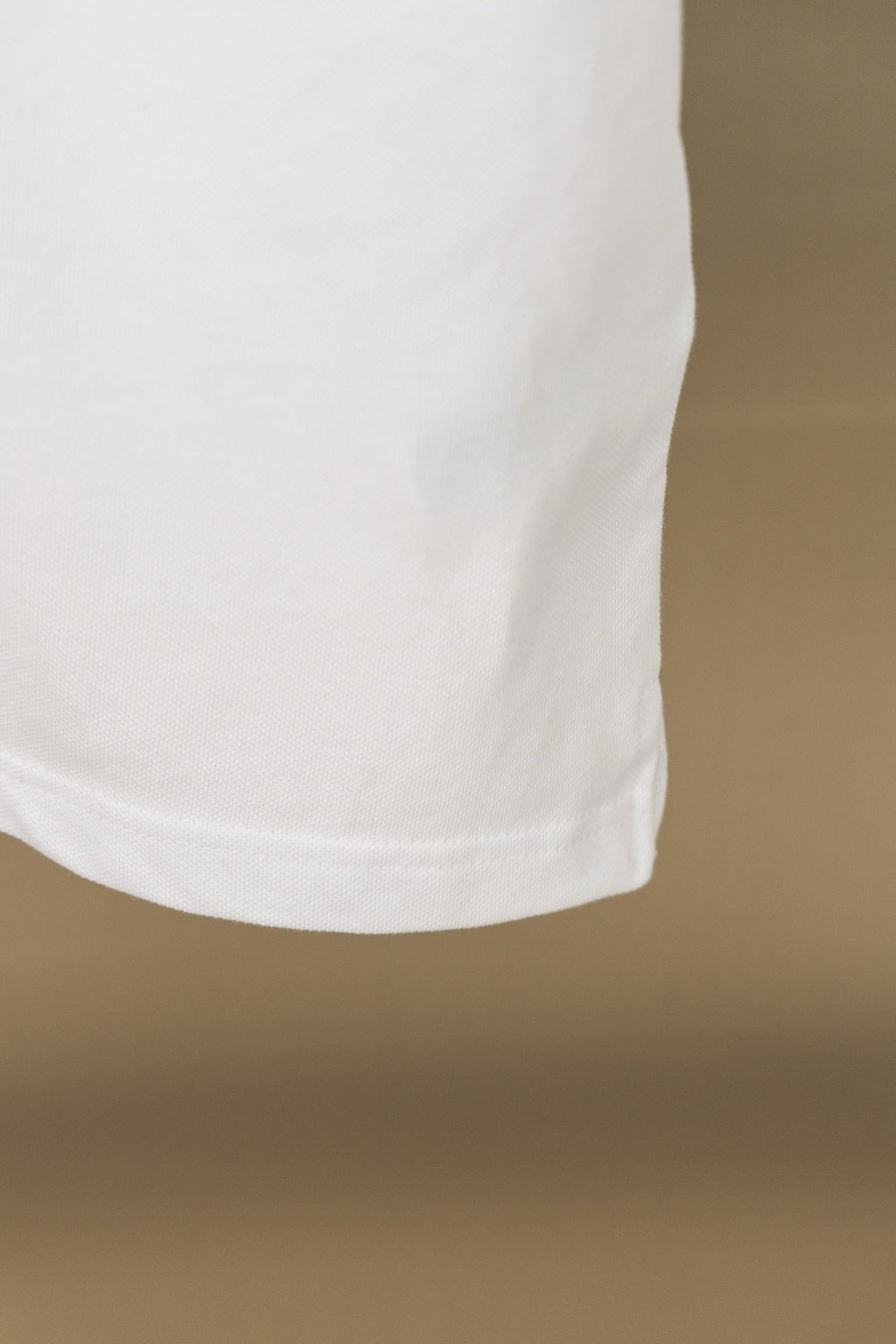 Burberry white polo shirt lower hem with stitching detail