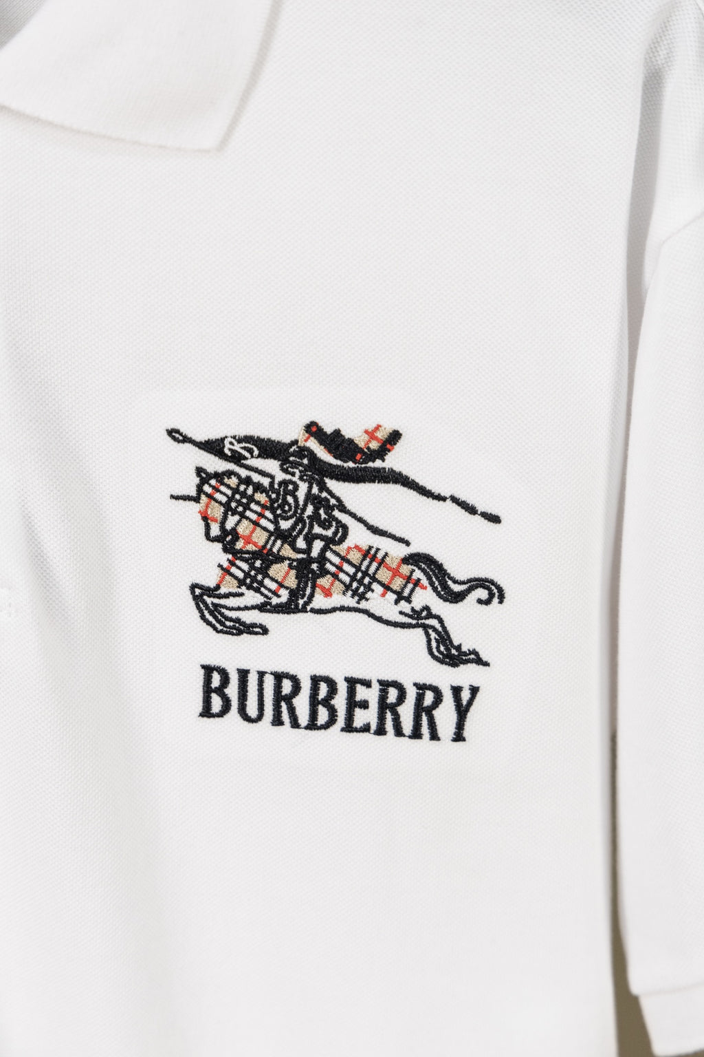Burberry white polo shirt with embroidered crest and BURBERRY lettering