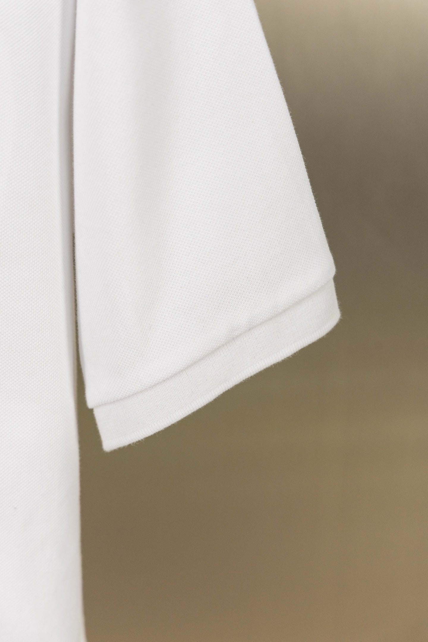 Burberry white polo shirt hem with side seam detail
