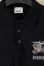 Black polo collar with two-button placket and Burberry crest on chest