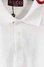 White polo shirt close-up of three-button placket and pointed collar