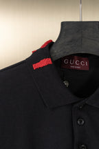 Black Gucci polo shirt neck label and red shoulder stripe, button front visible