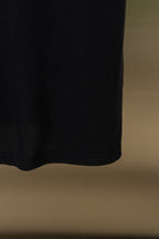 Black polo shirt hem and side seam, short length