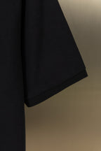 Black polo shirt short sleeve with curved hem, smooth knit fabric