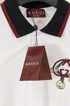 Gucci polo shirt with burgundy hang tag at collar