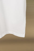 Gucci polo shirt lower side hem on white fabric