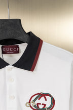 Gucci polo shirt with dark collar, red/green stripe, and embroidered logo