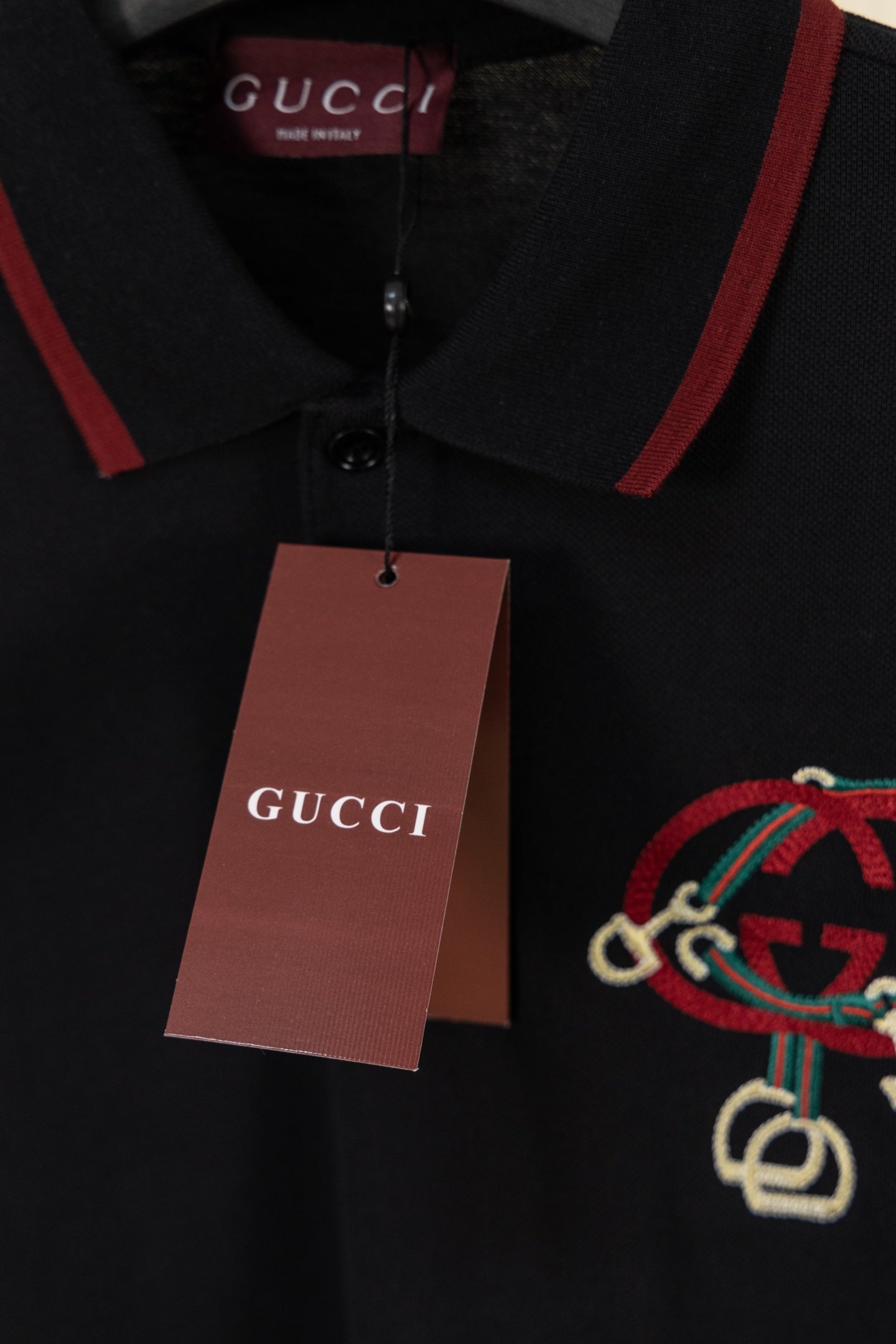 Gucci polo shirt with hang tag and red-trim collar