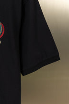 Gucci polo shirt side view with dark fabric and short sleeve