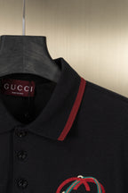 Gucci polo shirt collar detail with red stripe and crest embroidery