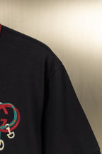 Gucci polo shirt sleeve with partial embroidered crest detail