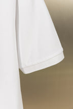 White polo shirt curved hem with side edge