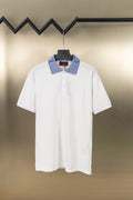 White polo shirt with blue striped logo collar and button placket