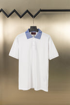 White polo shirt with blue striped logo collar and button placket