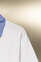 White polo shirt side with sleeve and seam detail