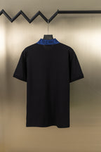 Black polo shirt with blue contrast collar and short sleeves