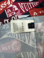 Short-sleeve shirt interior label at hem with white care tag and small dark brand patch