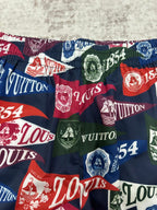 Multicolor patterned shorts fabric with Louis Vuitton text and 1854 crests