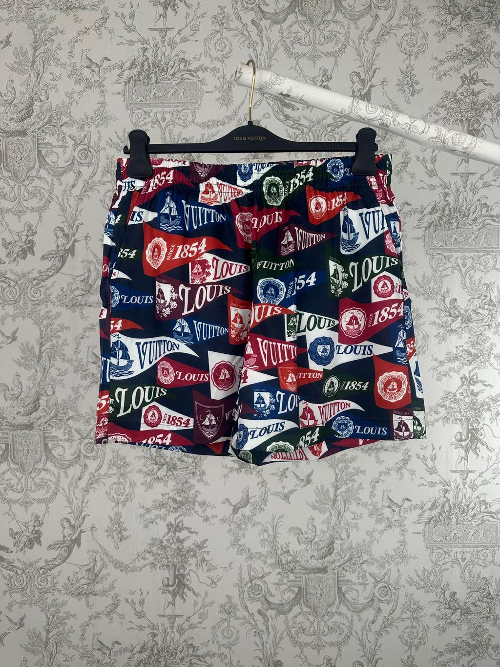 Louis Vuitton printed shorts with elastic waistband, multicolor logo and crest pattern