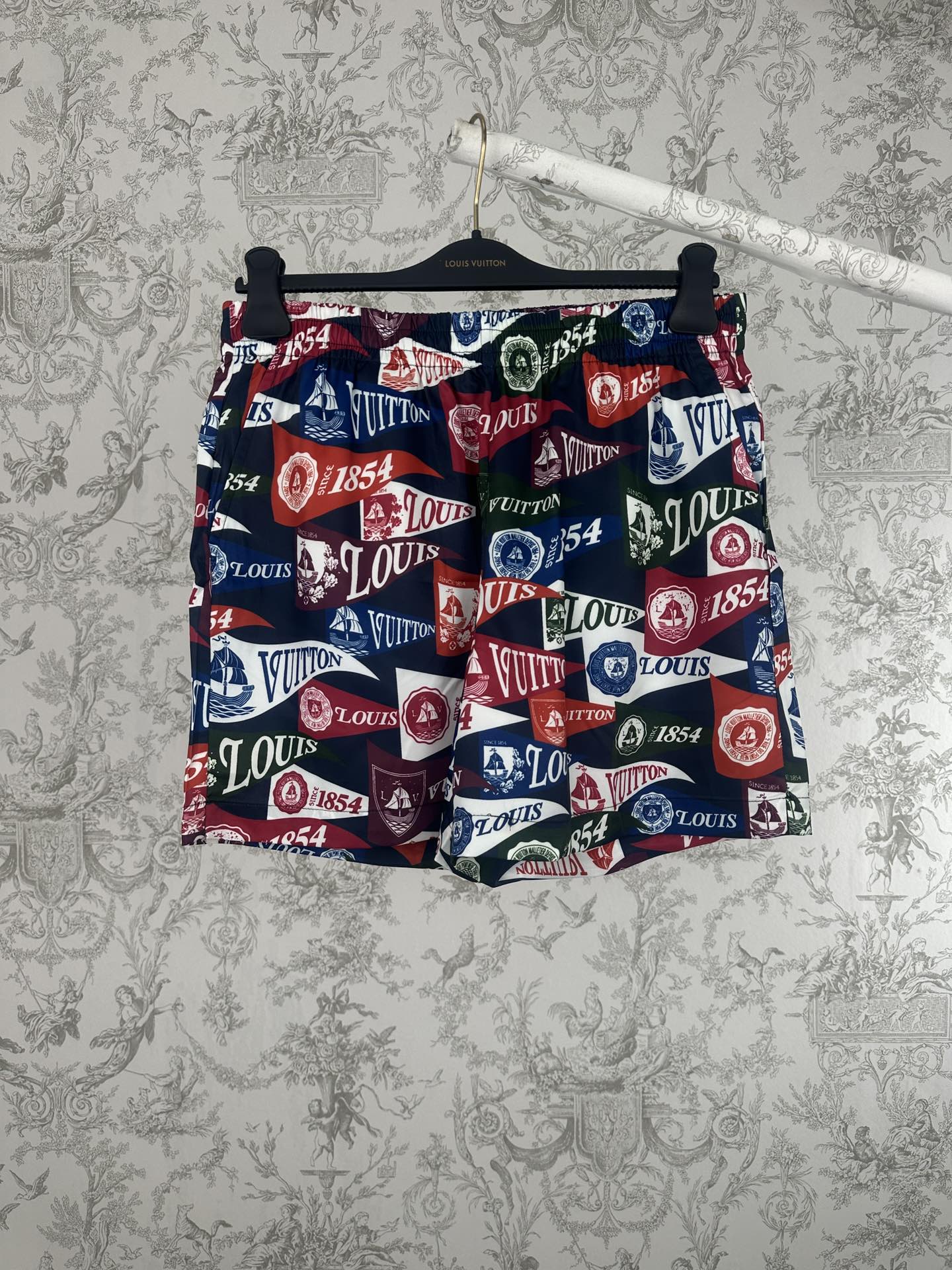 Louis Vuitton printed shorts with elastic waistband, multicolor logo and crest pattern
