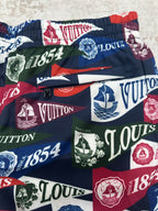 Multicolor logo shorts with elastic waistband, nautical sail and crest graphics