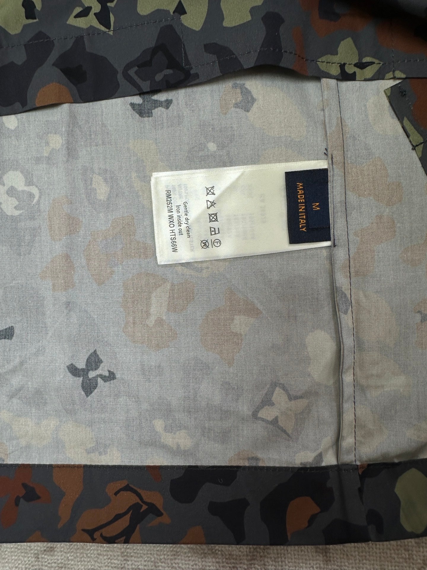 Louis Vuitton short-sleeve shirt care label on light interior fabric panel
