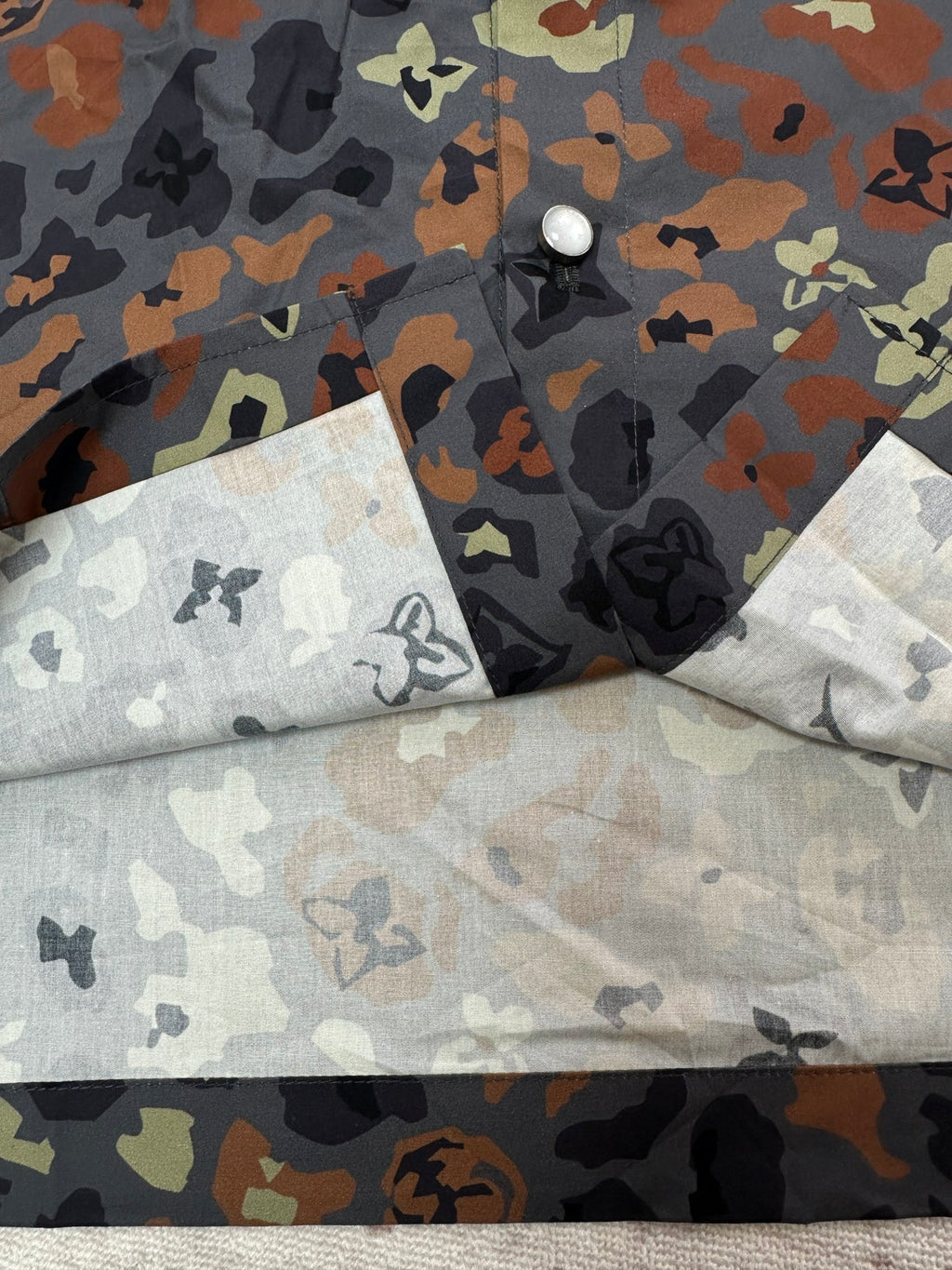 Louis Vuitton short-sleeve shirt folded with multicolor graphic print and button hardware