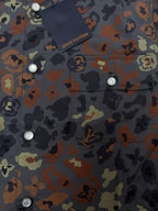Louis Vuitton short-sleeve shirt front close-up with buttons and multicolor graphic print