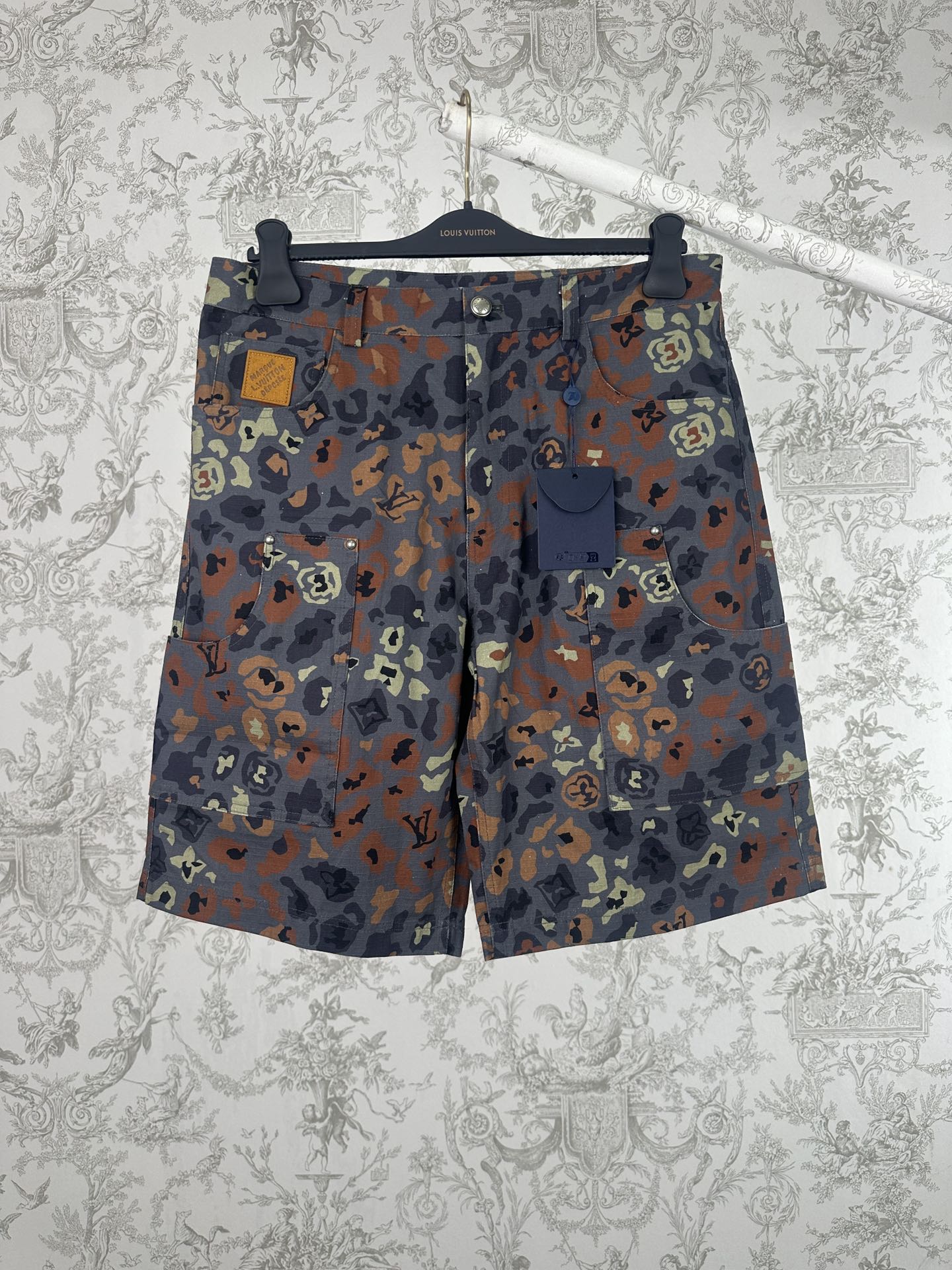 Men's patterned shorts with multicolor camo print, front button and zipper