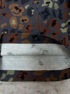 Patterned shorts waistband and folded interior lining at the front opening
