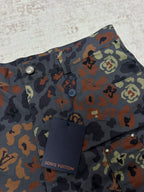 Patterned shorts front with button, coin pocket, and Louis Vuitton tag inside