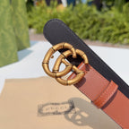 Two-tone leather belt with gold-tone buckle, black and tan